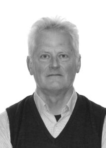 Greyscale photographic portrait of Sean Rainbird